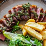Sliced Steak With Chips And Drinks